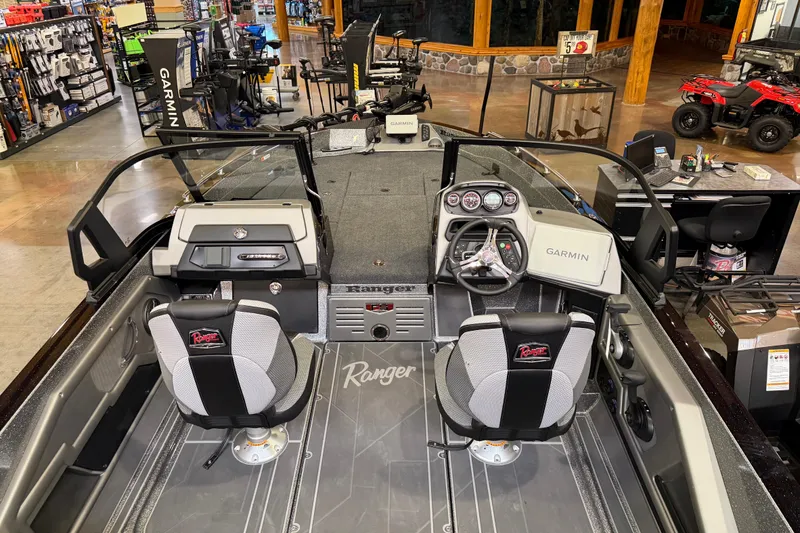 Slide: The Image of 2026 Ranger 621FS Cup-Equipped boat interior with Garmin electronics in a showroom. - 3
