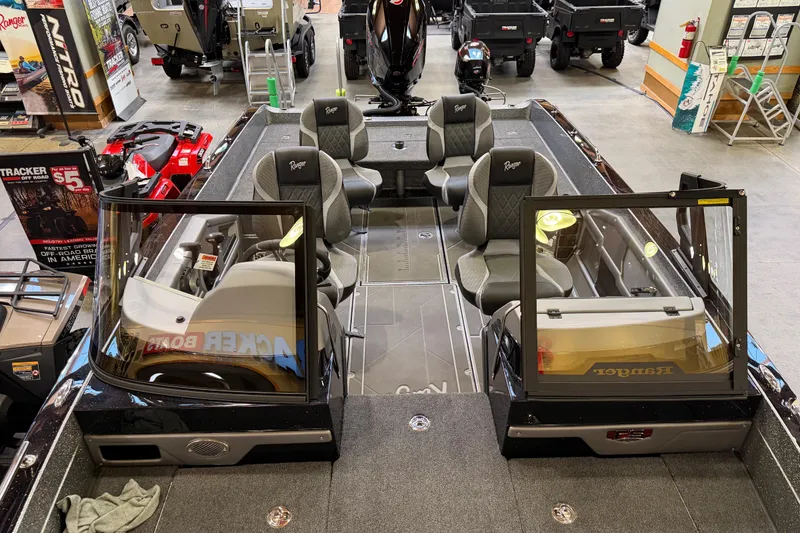 Slide: The Image of 2026 Ranger 621FS Cup-Equipped boat interior with seating and dashboard, displayed in showroom. - 8