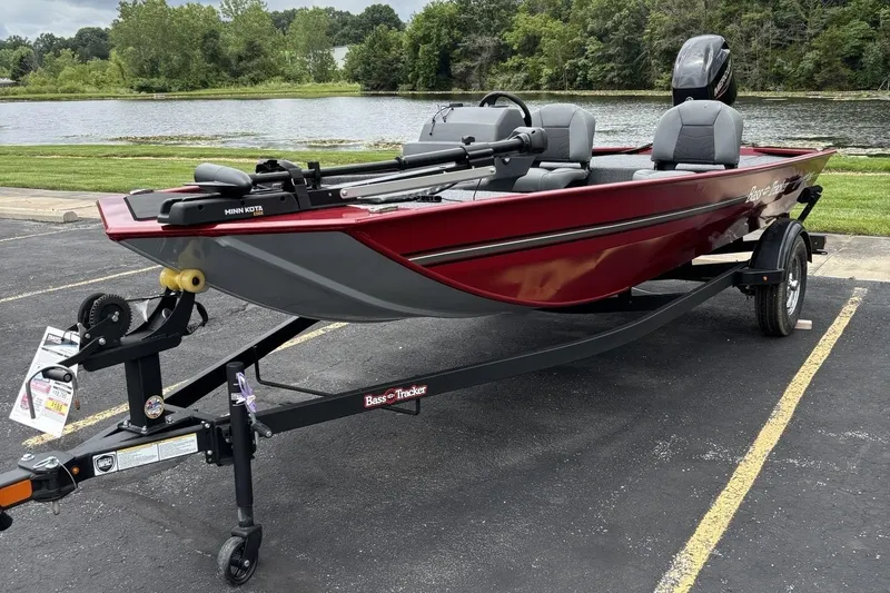 The Image of 2026 Tracker Bass Tracker Classic XL boat on trailer by a lake. - 0