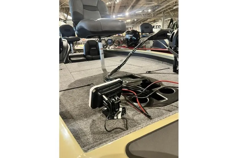 Slide: The Image of 2026 Tracker Pro Team 190 boat interior with seating and electronic equipment. - 2