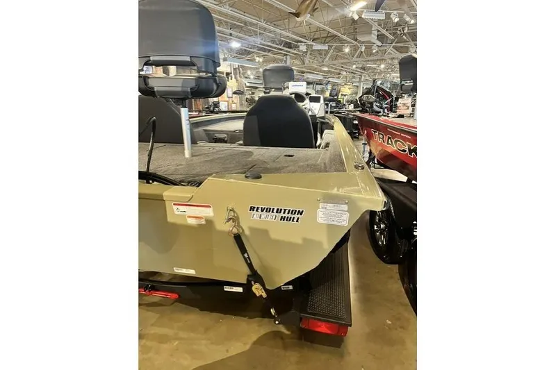 Slide: The Image of 2026 Tracker Pro Team 190 boat with Revolution hull, displayed indoors. - 58