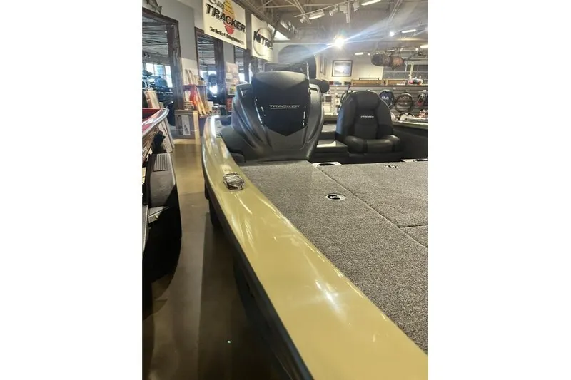 Slide: The Image of 2026 Tracker Pro Team 190 boat interior with seating and carpeted deck. - 5