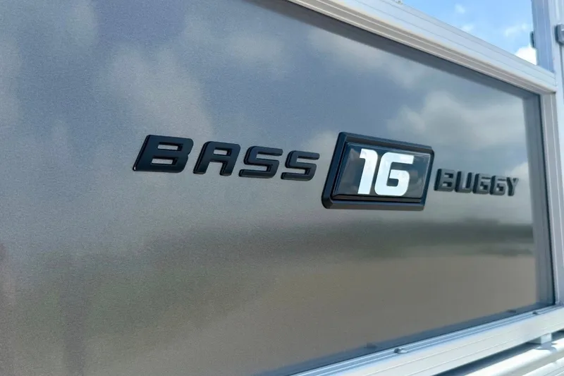 Slide: The Image of 2026 Sun Tracker Bass Buggy 16 XL Select logo on metallic surface. - 13