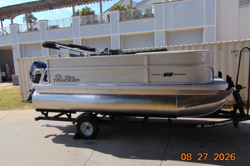 The Image of 2026 Sun Tracker Party Barge 16 DLX pontoon boat on trailer. - 0
