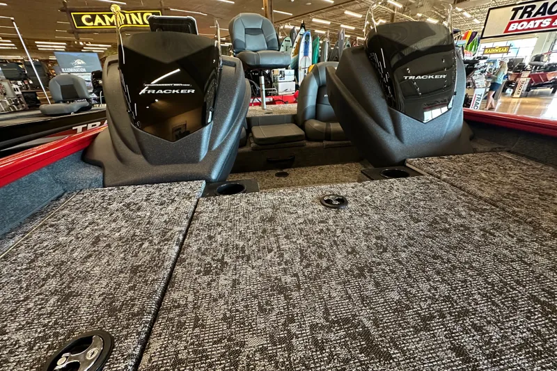Slide: The Image of 2026 Tracker Pro Team 175 boat interior with dual seats and carpeted deck. - 17