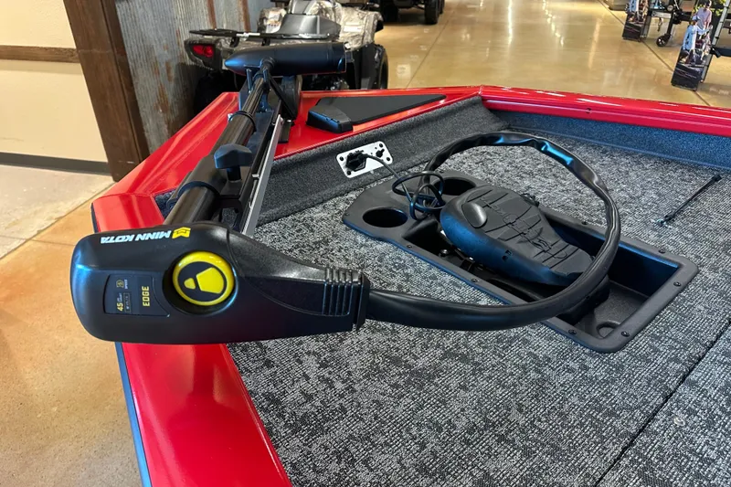 Slide: The Image of 2026 Tracker Pro Team 175 boat with Minn Kota trolling motor on red deck. - 15