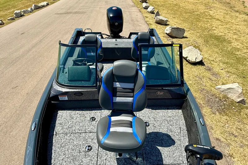 Slide: The Image of 2026 Ranger VS1782SC Reata boat with dual seats and windshield on a sunny day. - 9