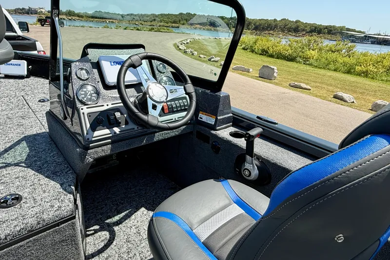 Slide: The Image of Interior of 2026 Ranger VS1782SC Reata boat with steering wheel and control panel. - 7