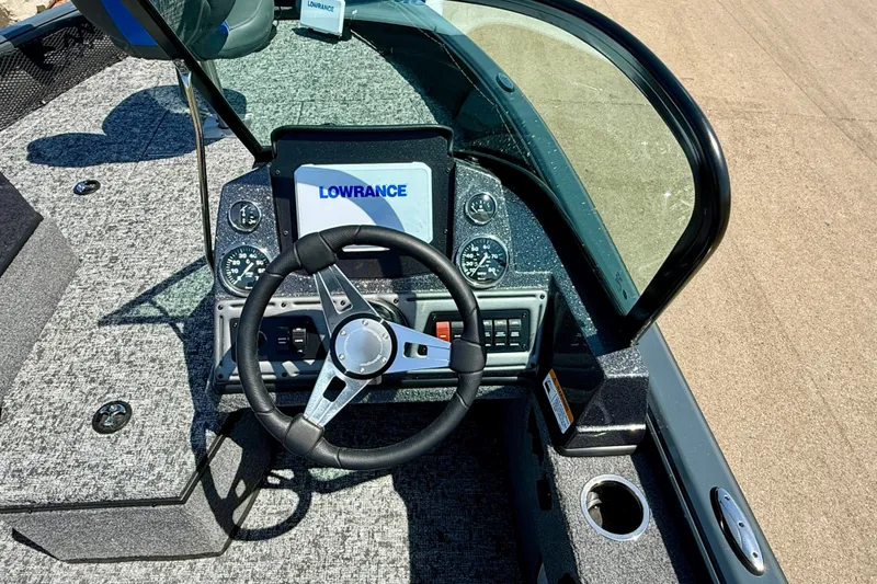 Slide: The Image of 2026 Ranger VS1782SC Reata boat dashboard with steering wheel and Lowrance display. - 8