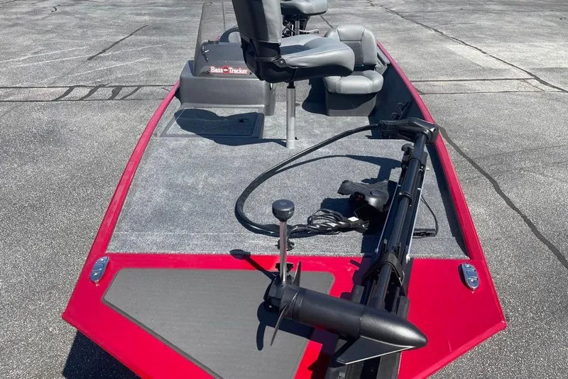 Slide: The Image of 2026 Tracker Bass Tracker Classic XL boat with red trim and fishing seats. - 2