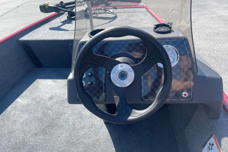 Slide: The Image of Steering wheel of 2026 Tracker Bass Tracker Classic XL boat, featuring a sleek dashboard design. - 3