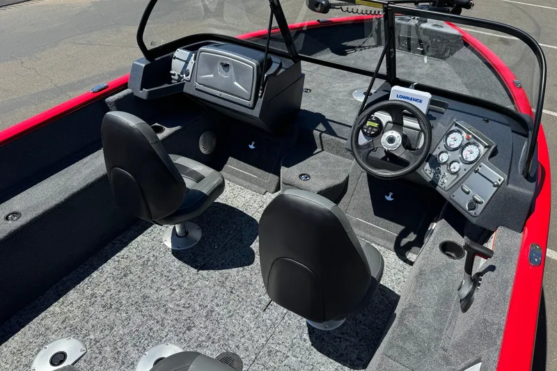 Slide: The Image of 2026 Tracker Pro Guide V-175 WT boat interior with steering console and seating. - 10