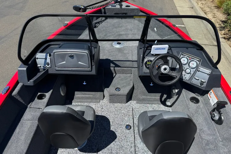 Slide: The Image of 2026 Tracker Pro Guide V-175 WT boat interior with steering console and seating. - 6