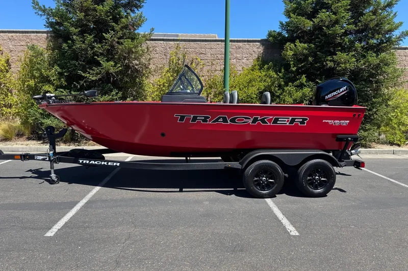 The Image of 2026 Tracker Pro Guide V-175 WT boat on trailer, parked outdoors. - 0