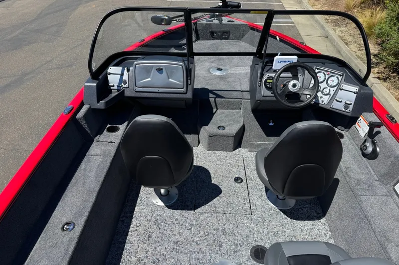Slide: The Image of 2026 Tracker Pro Guide V-175 WT boat interior with dual seats and modern dashboard controls. - 7