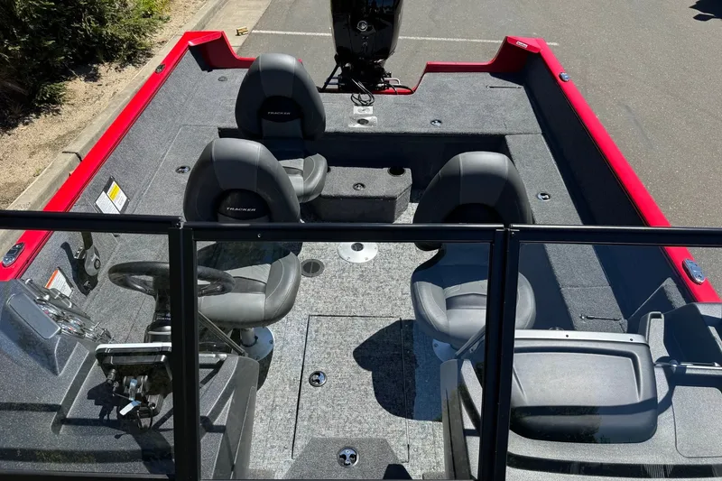 Slide: The Image of 2026 Tracker Pro Guide V-175 WT boat interior with seating and steering console. - 8
