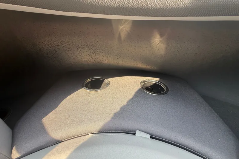 Slide: The Image of Interior view of 2026 Sun Tracker SportFish 20 DLX boat with cup holders. - 6