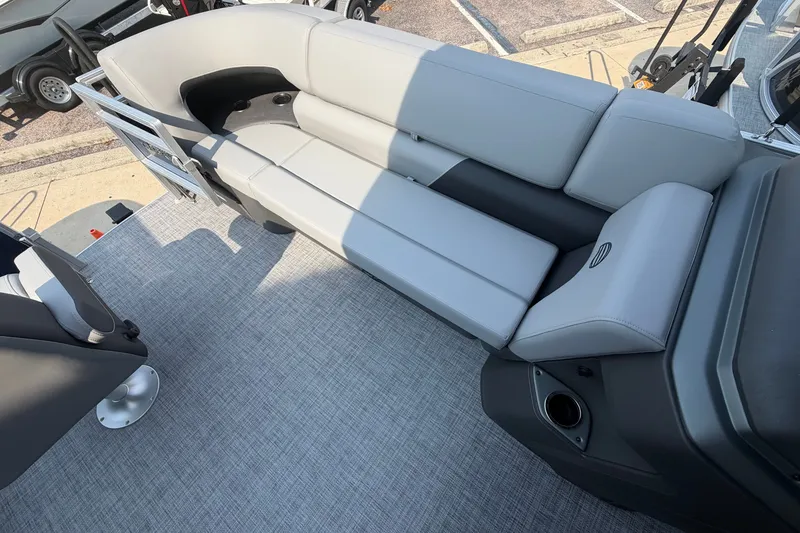 Slide: The Image of 2026 Sun Tracker SportFish 20 DLX boat interior with gray seating and carpeted flooring. - 5