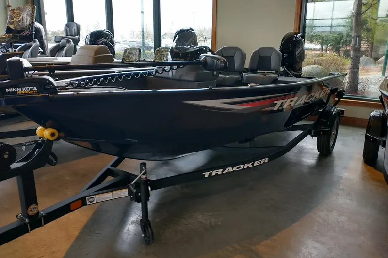 The Image of 2026 Tracker Super Guide V-16 SC boat displayed indoors on a trailer. - 0