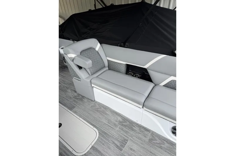 Slide: The Image of 2026 Crest Caribbean 250 SLRC boat interior with gray seating and modern design. - 10