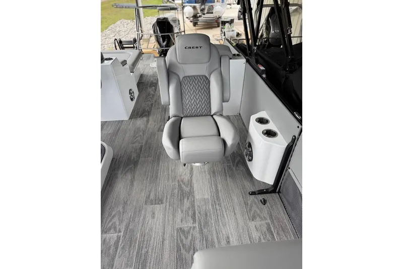 Slide: The Image of 2026 Crest Caribbean 250 SLRC boat interior with luxurious gray seating and modern design. - 11