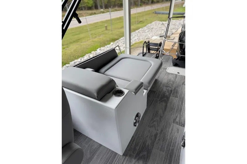 Slide: The Image of 2026 Crest Caribbean 250 SLRC boat interior with gray seating and cup holder. - 15