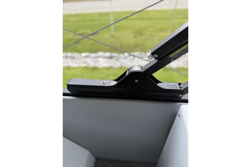 Slide: The Image of Close-up of a hinge mechanism on a 2026 Crest Caribbean 250 SLRC boat. - 17