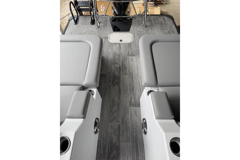 Slide: The Image of 2026 Crest Caribbean 250 SLRC boat interior with gray seating and sleek flooring. - 18
