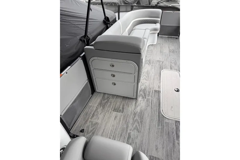 Slide: The Image of Interior of 2026 Crest Caribbean 250 SLRC boat with sleek seating and storage drawers. - 20