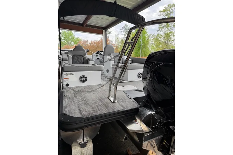 Slide: The Image of 2026 Crest Caribbean 250 SLRC pontoon boat with modern seating and sleek design. - 5