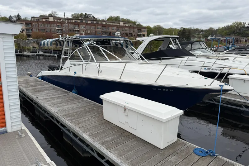 The Image of 2008 Fountain 33 Sportfish Cruiser docked at marina with overcast sky. - 0