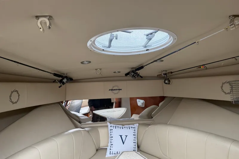 Slide: The Image of Interior of 2008 Fountain 33 Sportfish Cruiser with fishing rods and seating. - 14