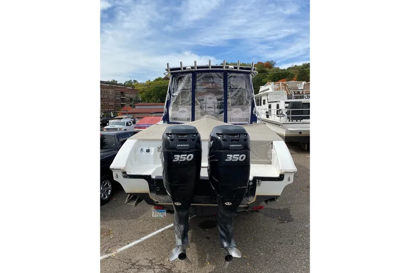 Slide: The Image of 2008 Fountain 33 Sportfish Cruiser with dual 350 Verado engines, docked outdoors. - 16