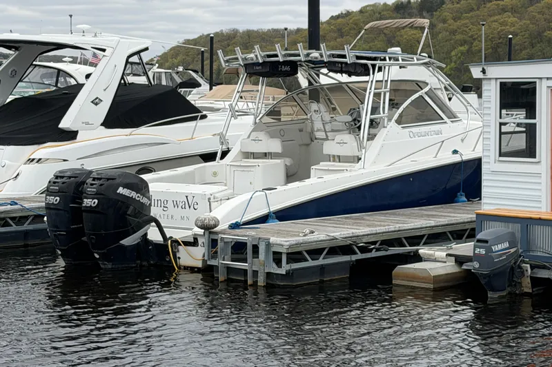 Slide: The Image of 2008 Fountain 33 Sportfish Cruiser docked with twin Mercury engines. - 2