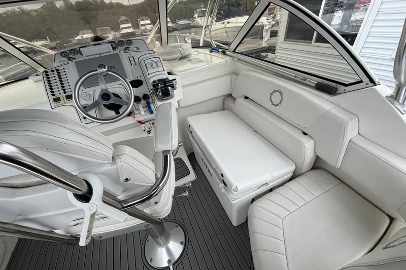 Slide: The Image of 2008 Fountain 33 Sportfish Cruiser cockpit with steering wheel and seating area. - 9