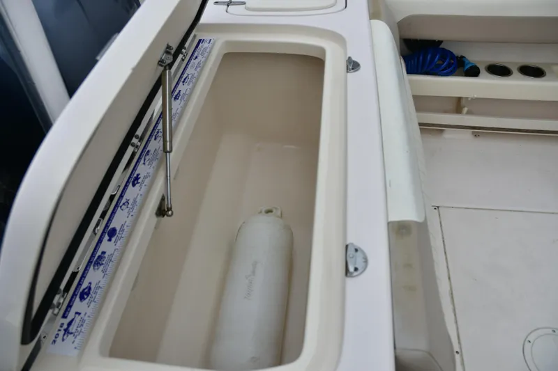 Slide: The Image of Open storage compartment on a 2013 Grady-White Freedom 275 boat. - 4