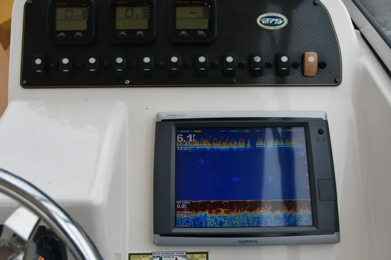 Slide: The Image of Dashboard of 2013 Grady-White Freedom 275 with Garmin display and control panel. - 7