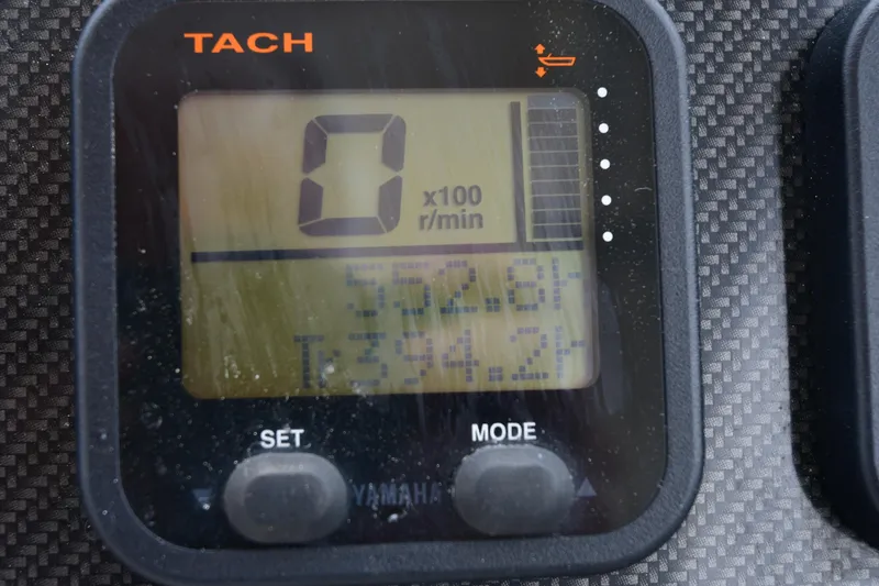 Slide: The Image of Tachometer display on 2013 Grady-White Freedom 275 boat, showing RPM and engine hours. - 9