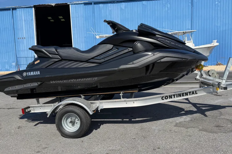 The Image of 2024 Yamaha WaveRunner FX SVHO on trailer, parked near blue building. - 0