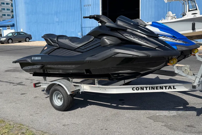 Slide: The Image of 2024 Yamaha WaveRunner FX SVHO on trailer, parked outdoors near blue building. - 6