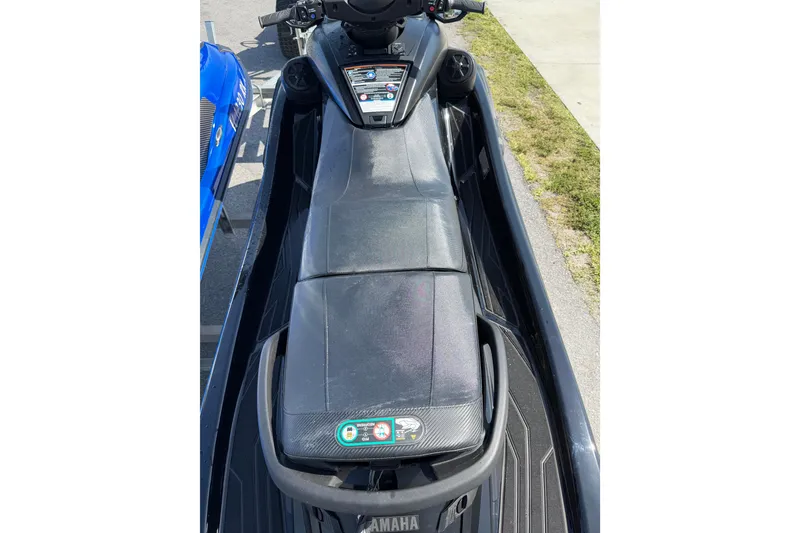 Slide: The Image of 2024 Yamaha WaveRunner FX SVHO, black seat, top view, parked on pavement. - 7