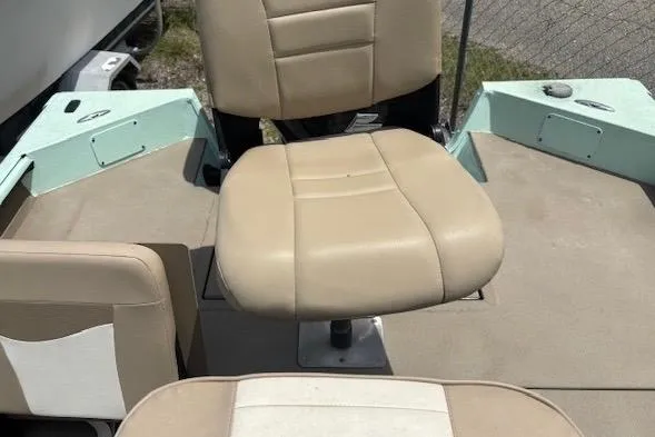 Slide: The Image of 2023 Sea Ark 190BX boat interior with beige seating and deck. - 10