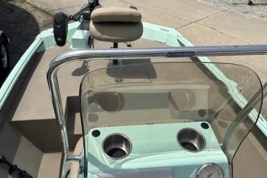Slide: The Image of 2023 Sea Ark 190BX boat interior with steering console and seating. - 3
