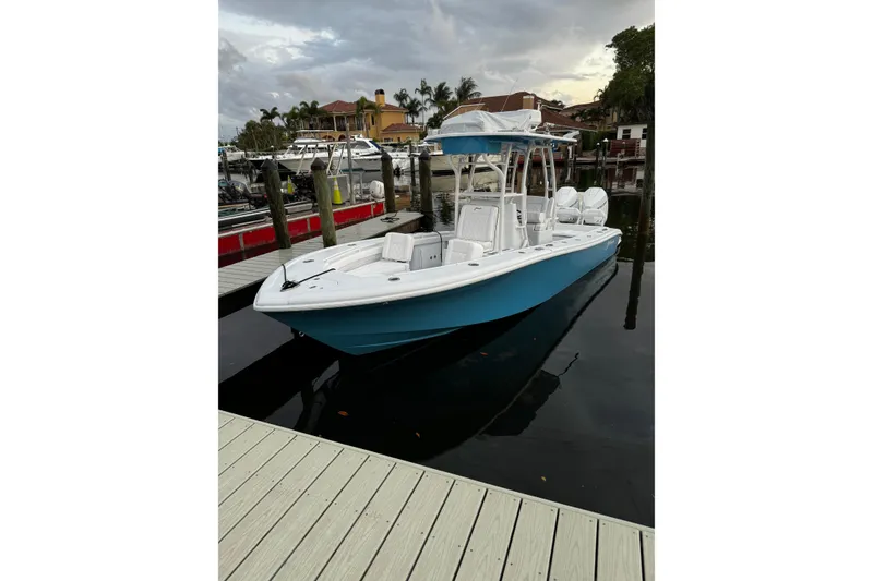 Slide: The Image of 2024 Yellowfin 26 Hybrid boat docked, featuring sleek design and modern amenities. - 3