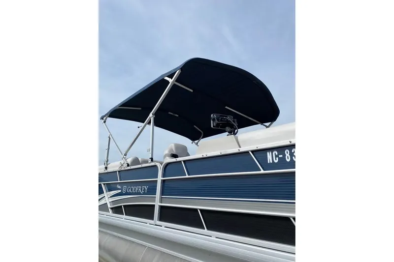 Slide: The Image of 2022 Godfrey Sweetwater 2286 SBX pontoon boat with canopy, side view. - 12
