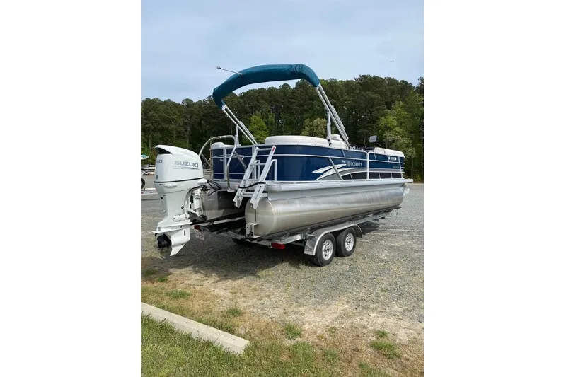 Slide: The Image of 2022 Godfrey Sweetwater 2286 SBX pontoon boat with Suzuki engine on trailer. - 14