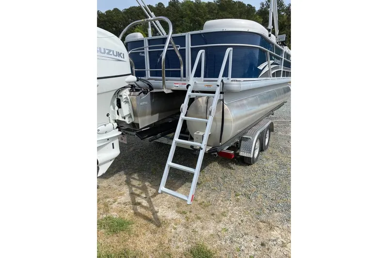 Slide: The Image of 2022 Godfrey Sweetwater 2286 SBX pontoon boat on trailer with Suzuki engine. - 15