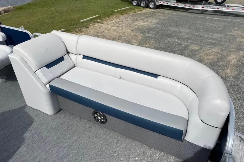 Slide: The Image of 2022 Godfrey Sweetwater 2286 SBX boat interior with white and blue seating. - 3