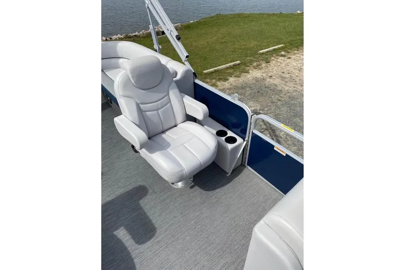 Slide: The Image of Luxurious seating on 2022 Godfrey Sweetwater 2286 SBX pontoon boat by the water. - 8