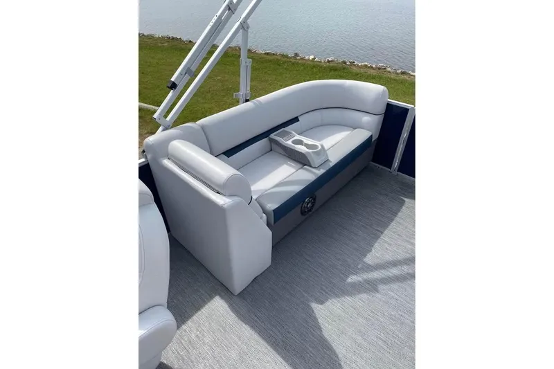Slide: The Image of 2022 Godfrey Sweetwater 2286 SBX pontoon boat interior with cushioned seating and cup holders. - 9